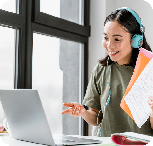 Woman with headphones having video call with laptop